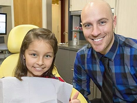 Dr. Wolbaum with a child patient
