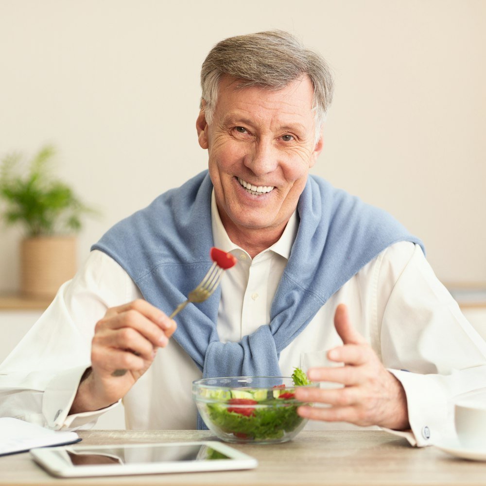 Mature man eating